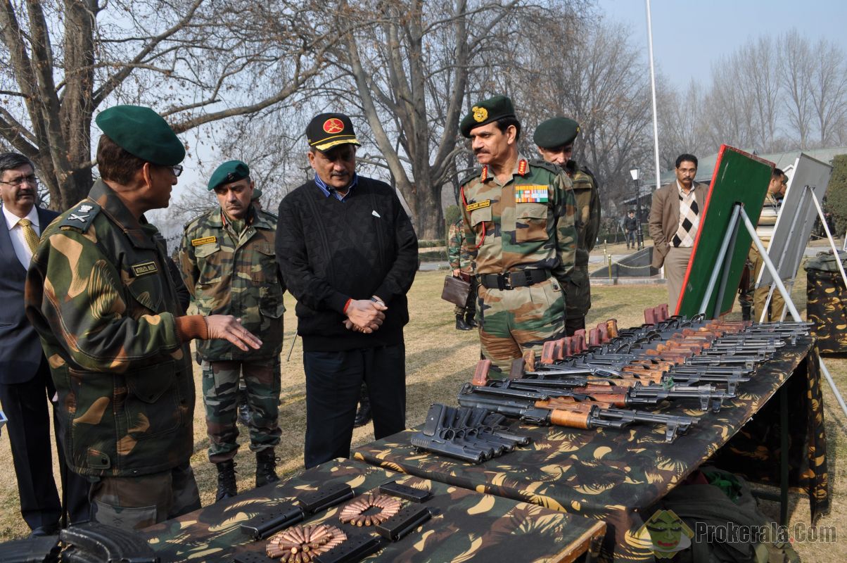 Defence Minister Manohar Parrikar inspects the weapons and ammunition