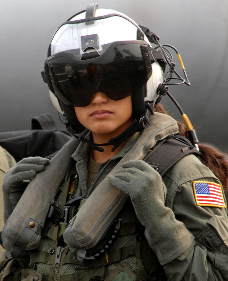 Aviation girl Rocio Britos US Navy AWSO 2nd Class assigned to the Dusty Dogs of Helicopter Anti Submarine Squadron HS 7 waits to board an SH 60 Seahawk on board Nimitz class aircraft carrie.