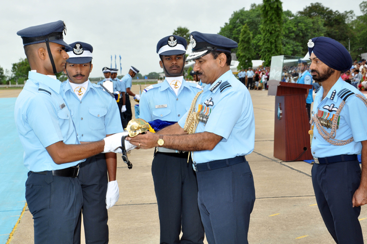 Chief of the Air Staff, Air Chief Marshal Arup Raha presenting the Sword of Honor for standing first in overall order of merit to Flying Officer Himanshu Kanwar