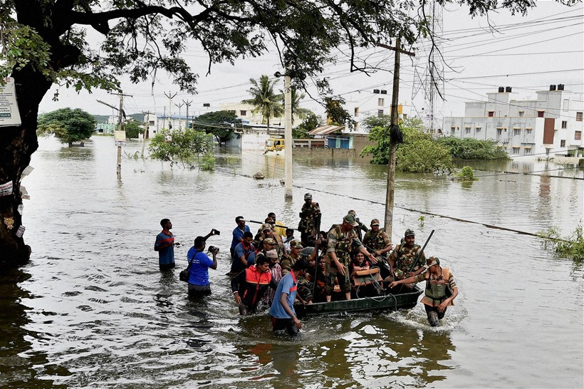 Chennai: Army personnel rescuing people during their flood relief operations in rain-hit areas of Chennai on Tuesday. PTI Photo (PTI11_17_2015_000178A)