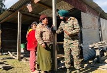 indian army helping a lady